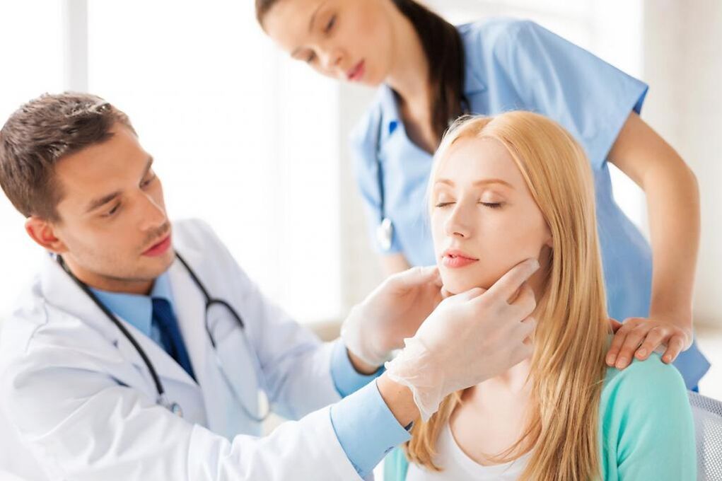 Doctor examining a patient with papilloma